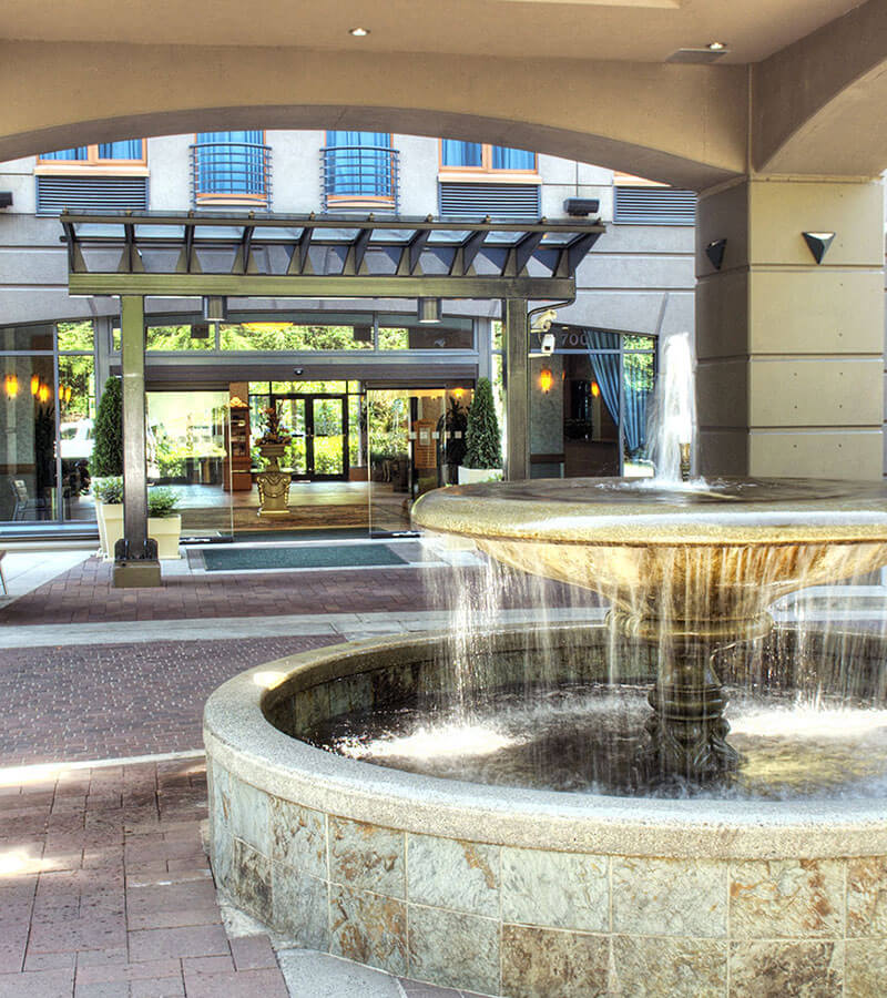 A glistening water fountain welcomes visitors to the Holiday Inn North Vancouver